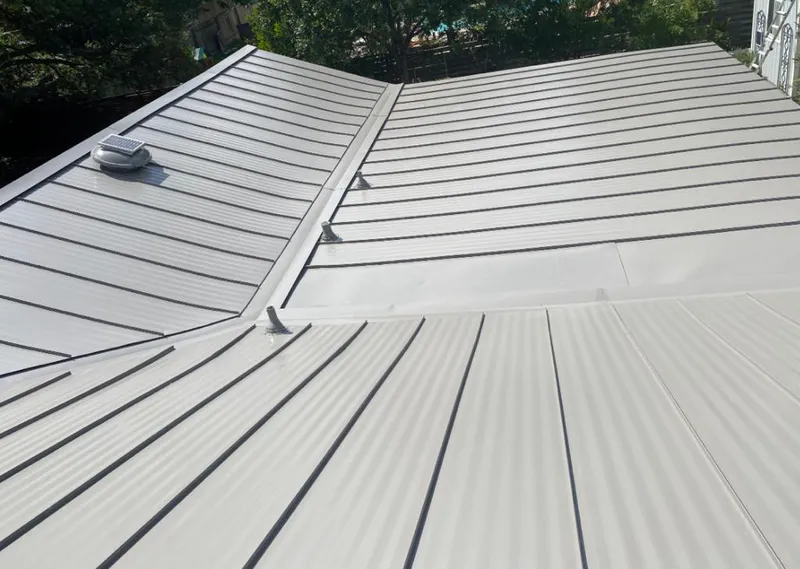 Solar attic fan installed on a metal roof for Roof Ventilation in McGregor